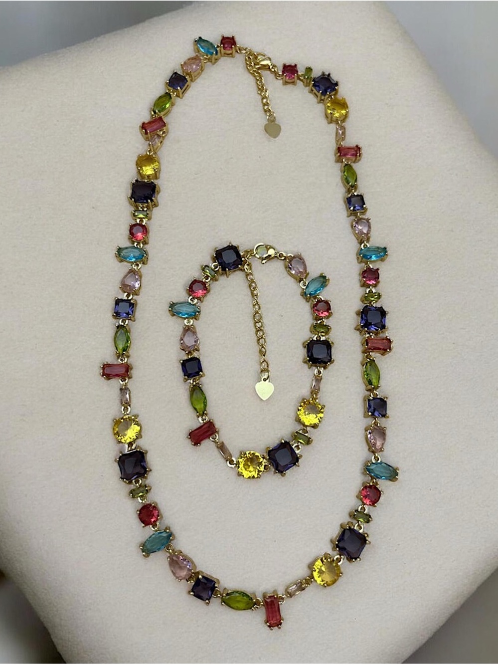 Elegant multicolor crystal necklace and matching bracelet in a gold-tone